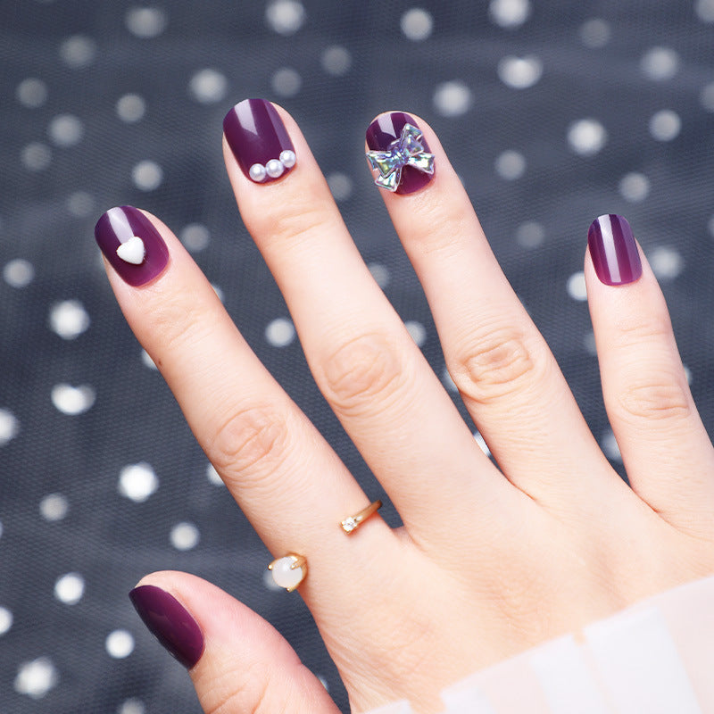 Wearing Nails With Diamonds And Purple Fake Nails